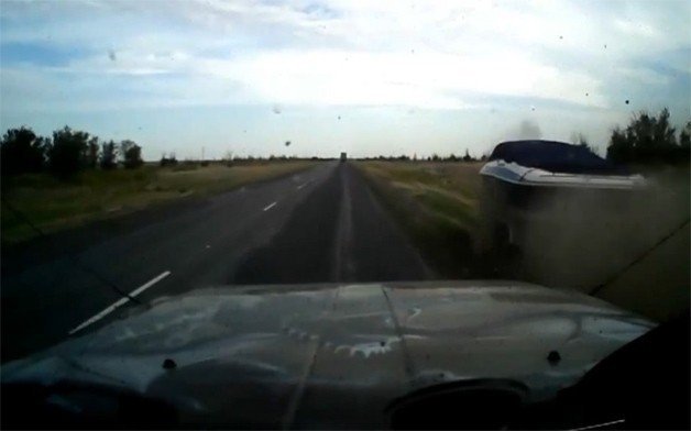 Boat Passes Car on Highway in - Where Else – Russia