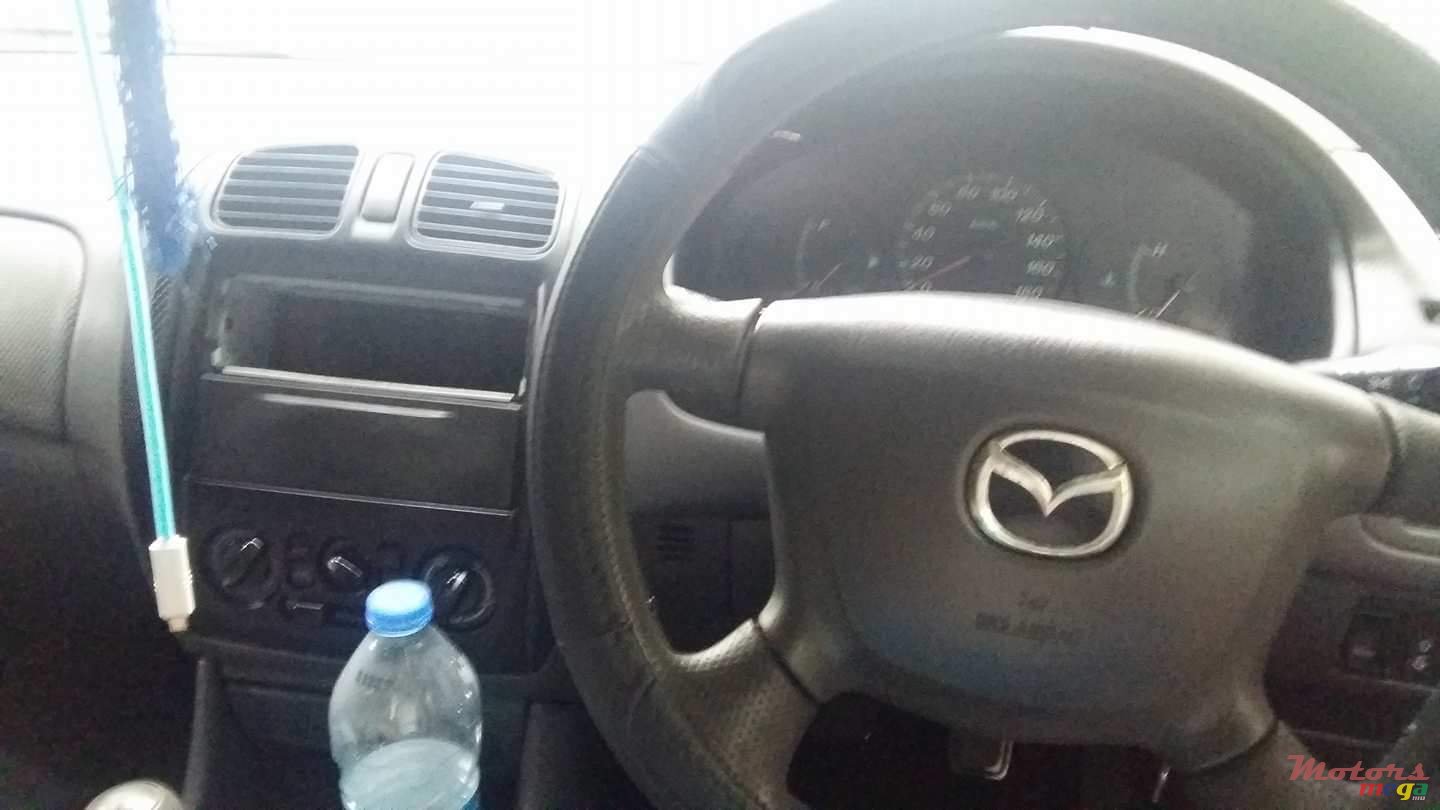 1999' Mazda 323 photo #6