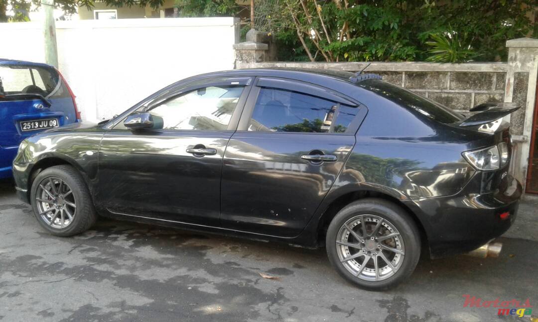 2004' Mazda 3 photo #1