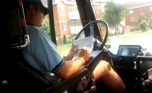 Passenger catches Canadian bus driver doing paperwork while driving