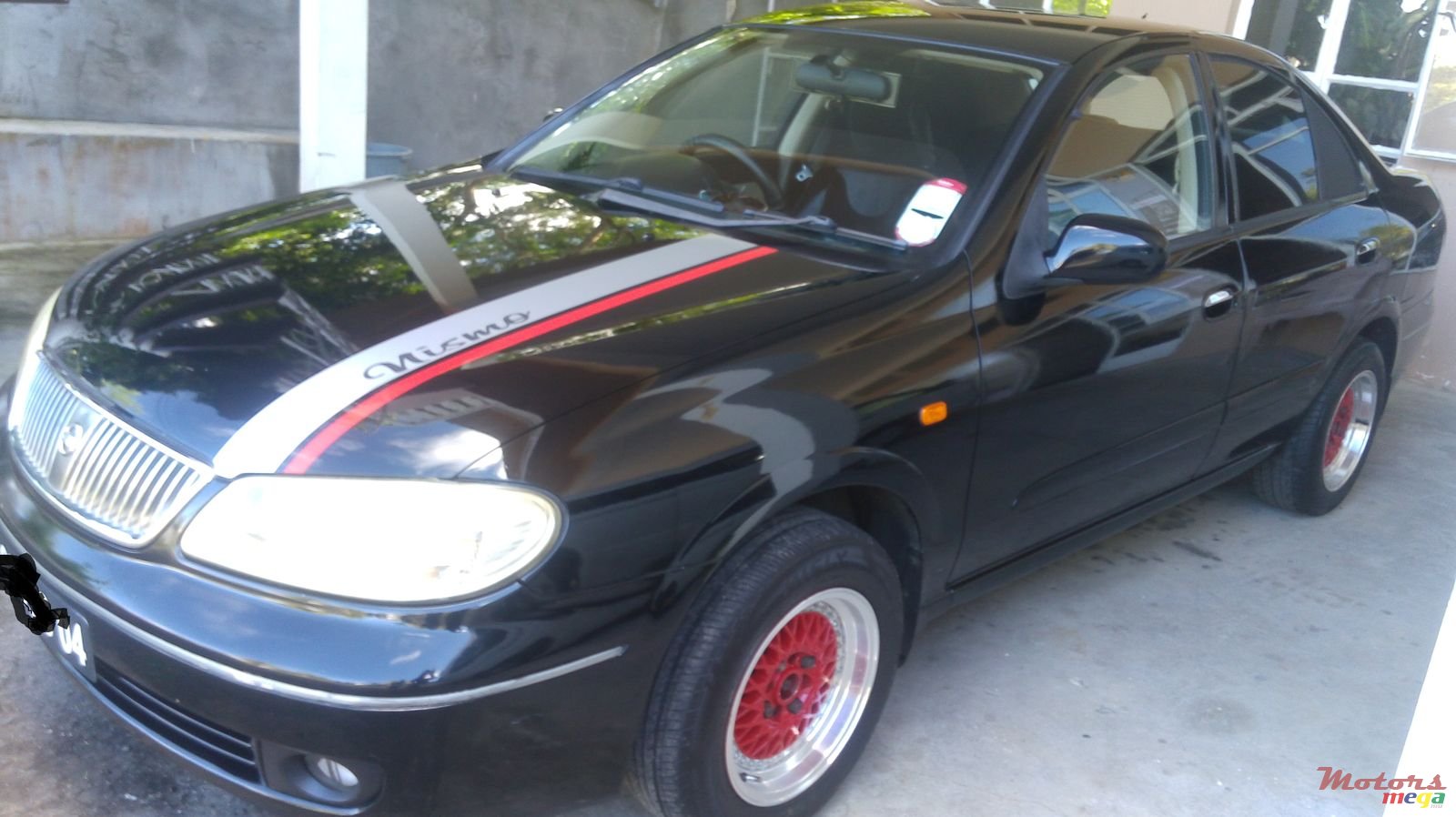 2004' Nissan Sunny photo #1