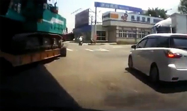 Impatient Driver Hooked By In-Tow Crane