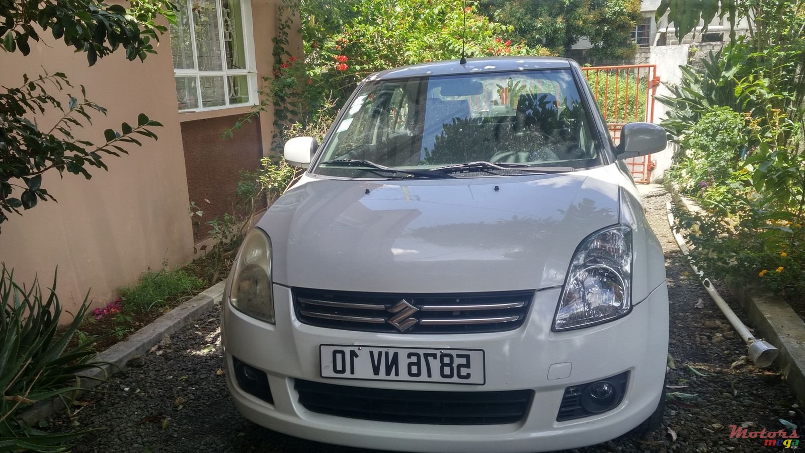 2010' Suzuki Swift Dzire photo #1