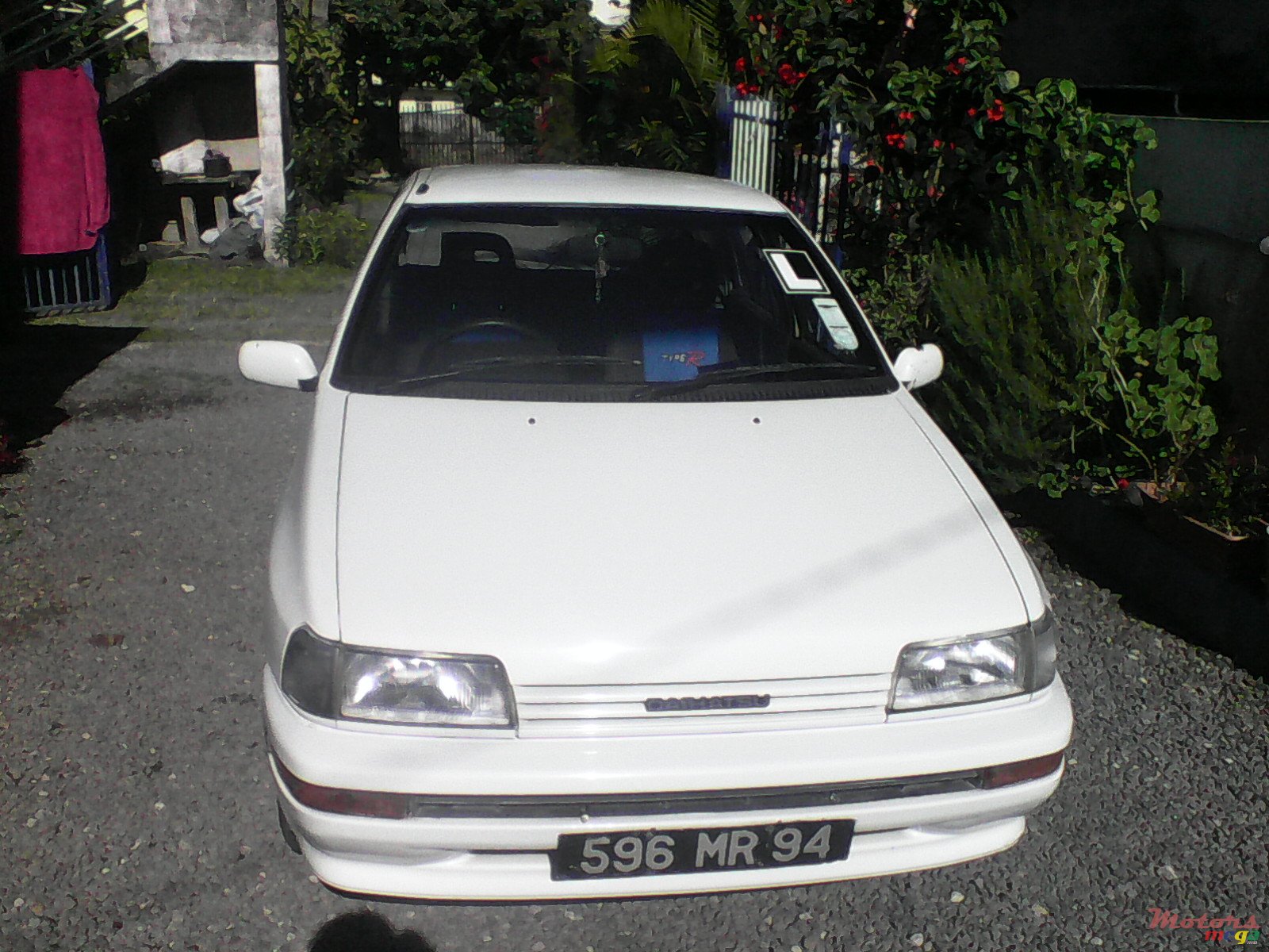 2004' Daihatsu Charade photo #1