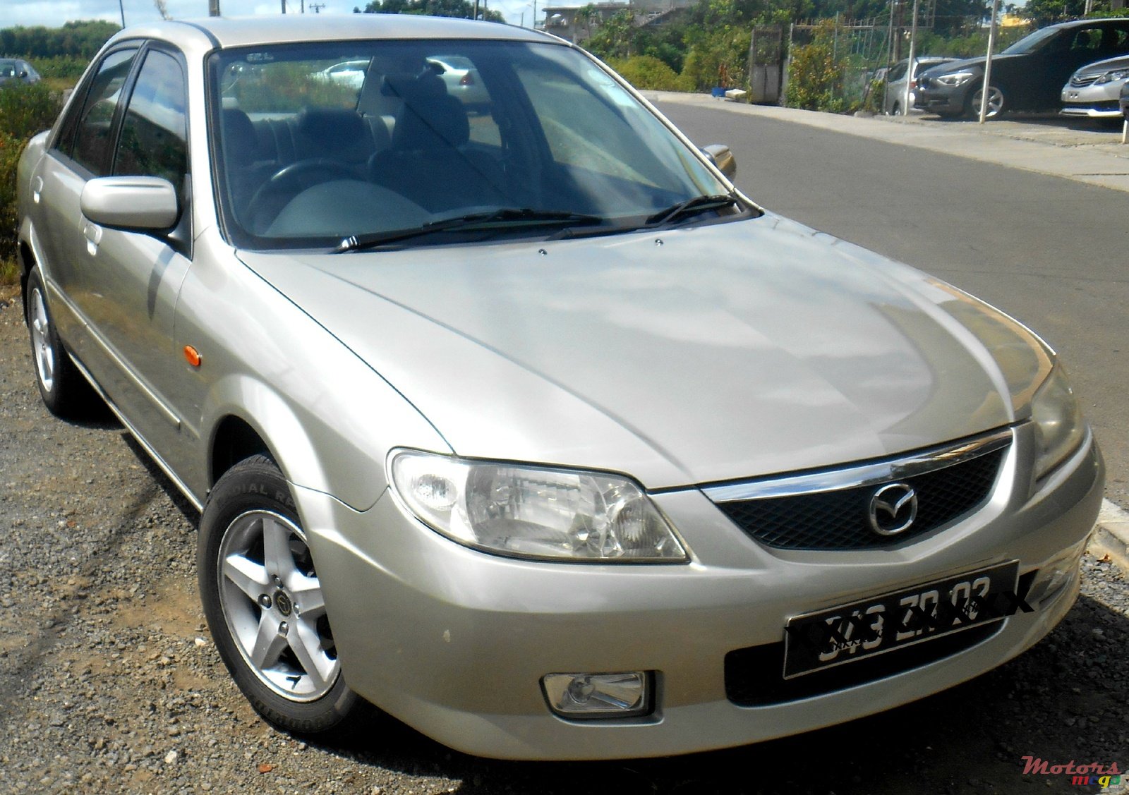 2002' Mazda saloon photo #1