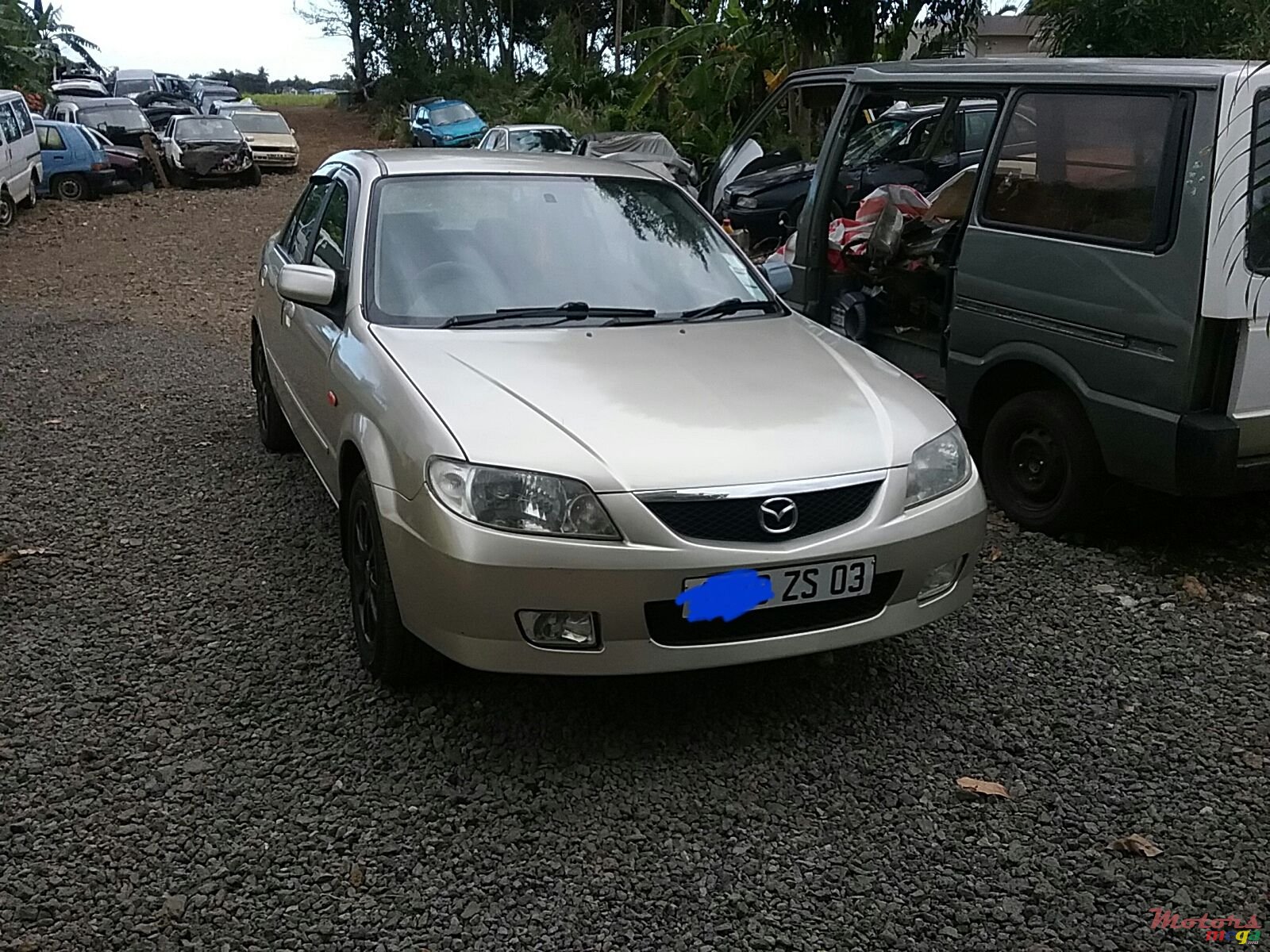 2003' Mazda 323 photo #1