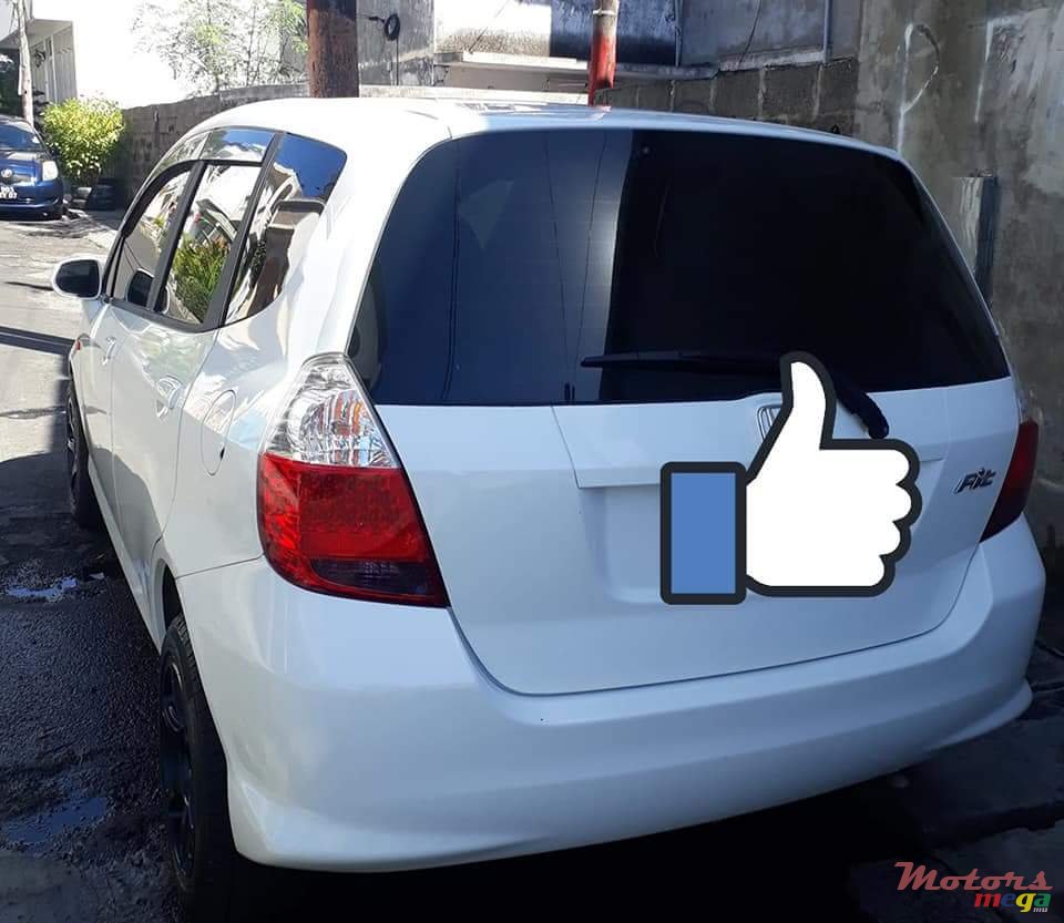 2004' Honda Fit Tinted windows, alloy tires photo #3