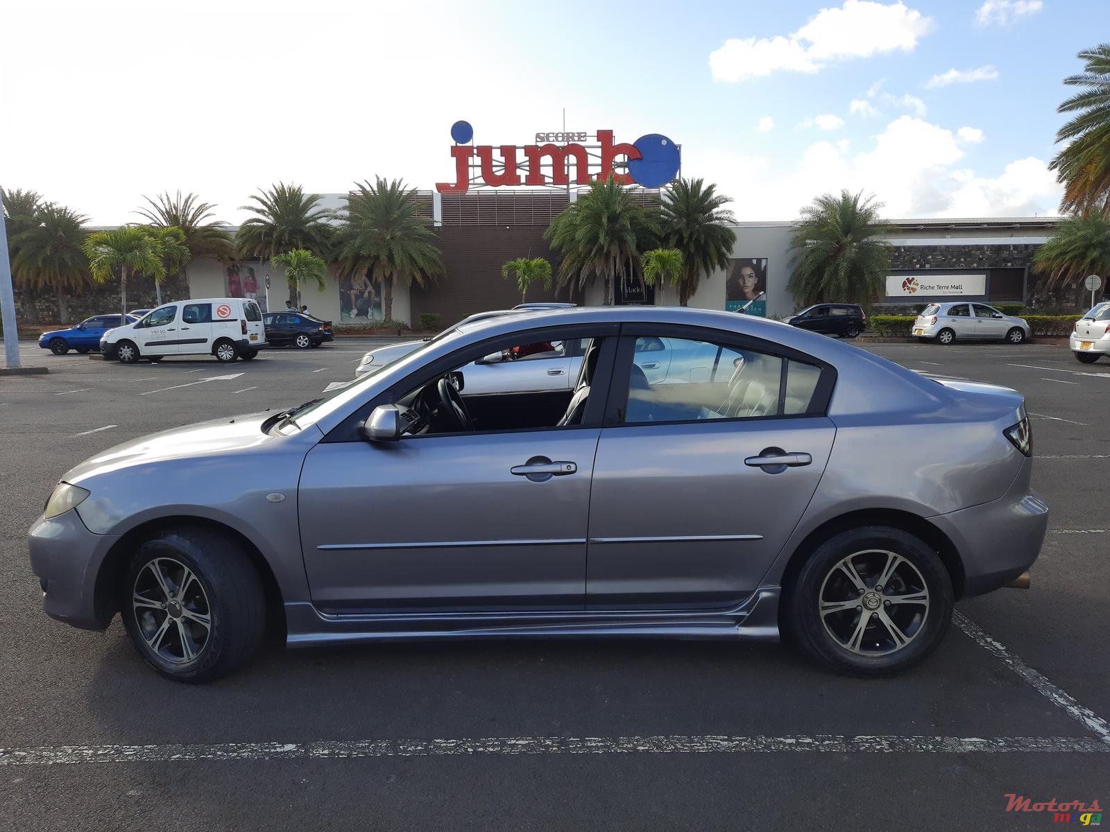 2004' Mazda 3 photo #1