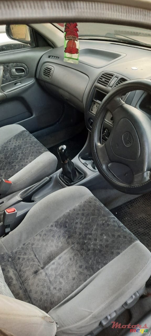 1999' Mazda 323 photo #5
