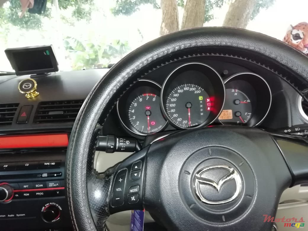 2004' Mazda 3 photo #1