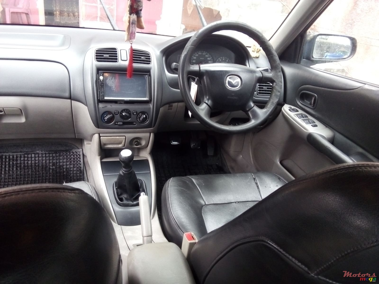 2002' Mazda 323 photo #1