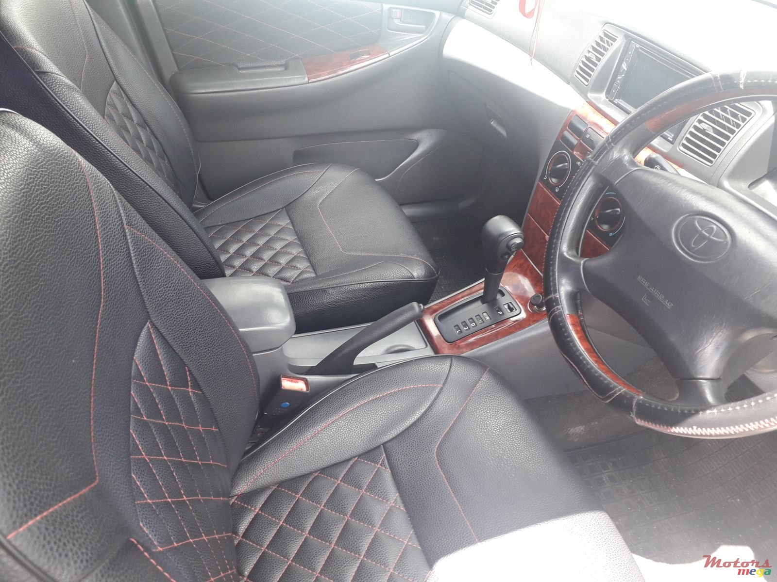 2002' Toyota Corolla NZE auto photo #3