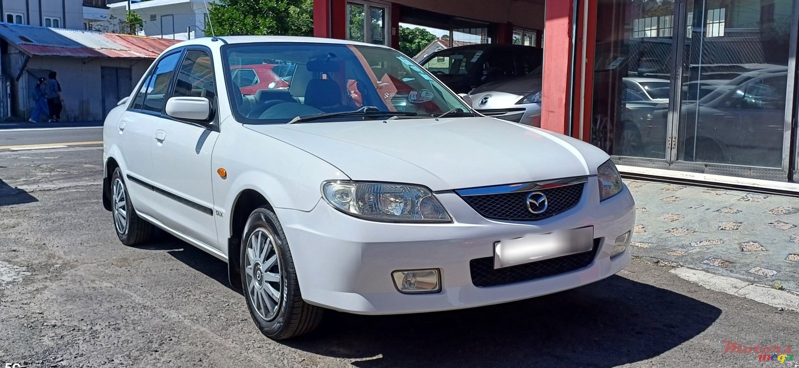 2003' Mazda 323 photo #1