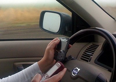 Driver caught on TWO phones!