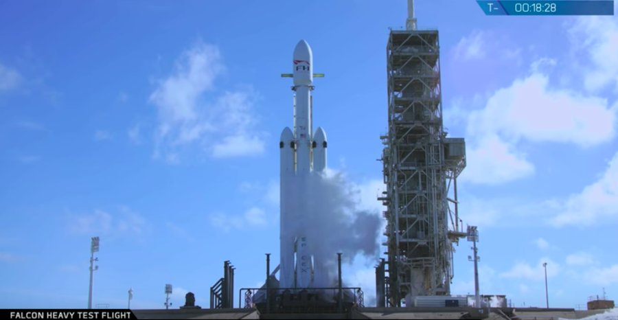Watch as new SpaceX jumbo rocket shoots a Tesla into space