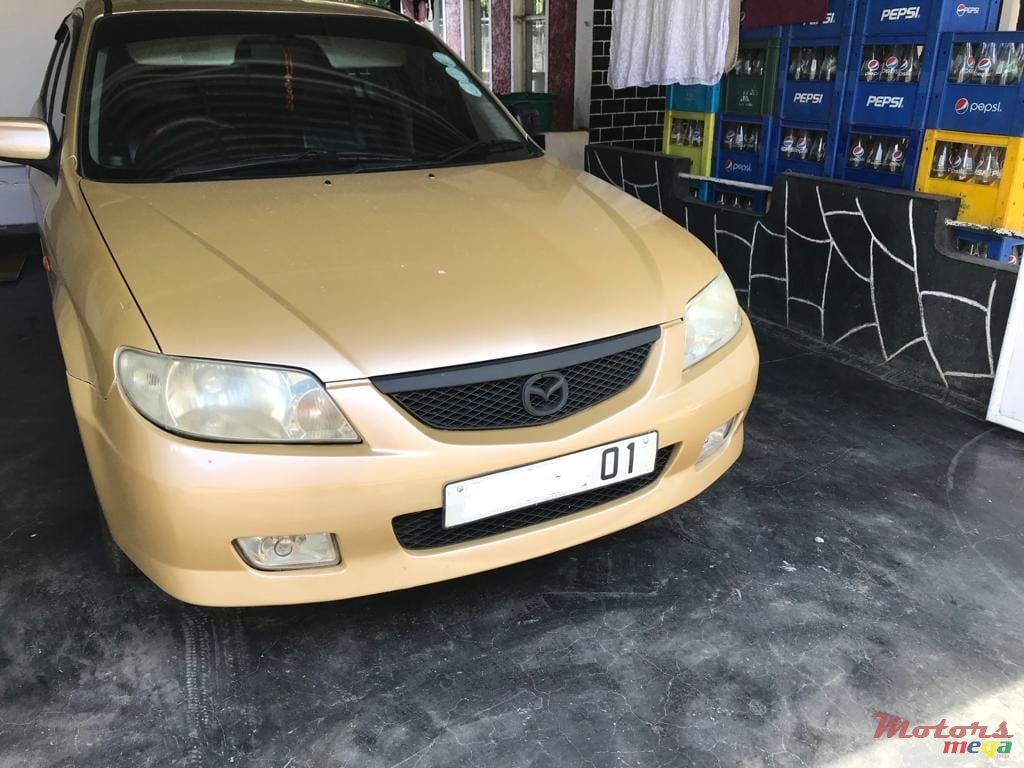 2001' Mazda 323 photo #1