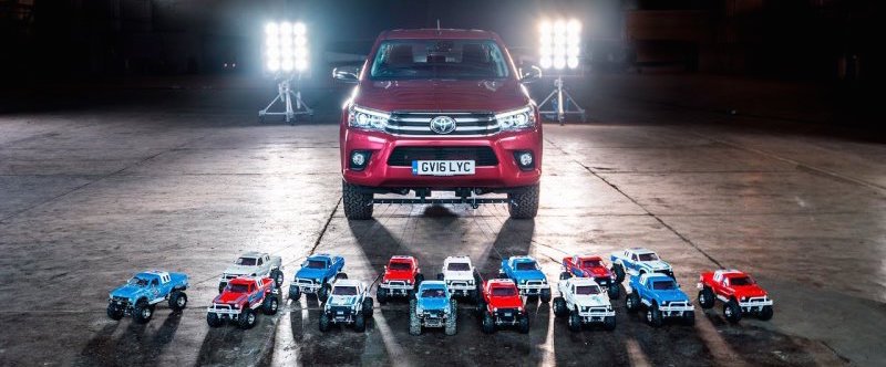 Watch these tiny radio-controlled Toyotas tow a full-size Hilux