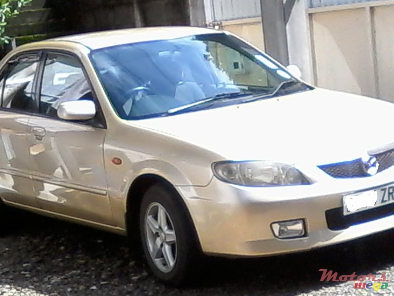 2002' Mazda 323 photo #1