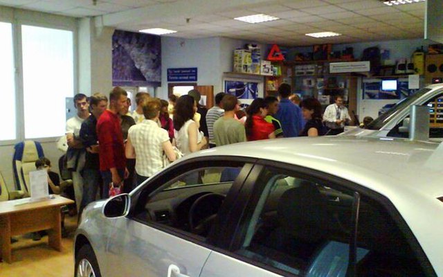 People queueing to buy a car