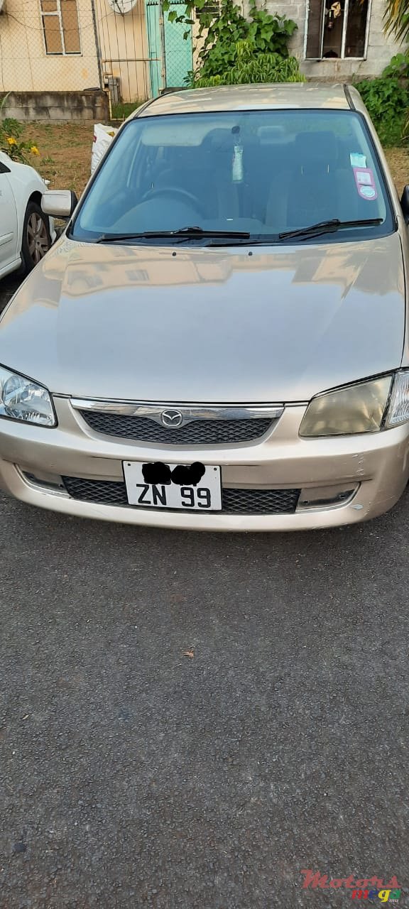 1999' Mazda 323 photo #1
