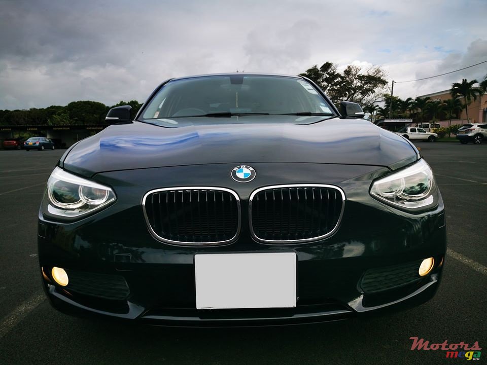 2011' BMW 116 i photo #1