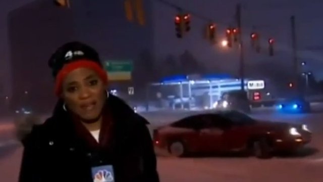 Nissan Driver Drifts on Snowy Roads During News Broadcast