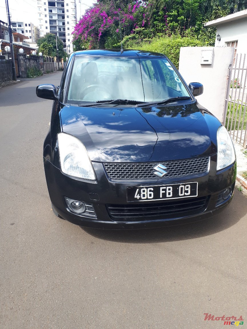 2009' Suzuki Swift ZXI photo #1