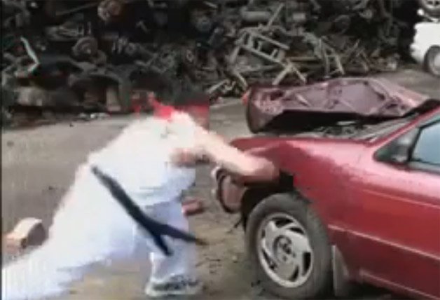 Watch A Street Fighter Lookalike Destroy This Car With His Bare Hands