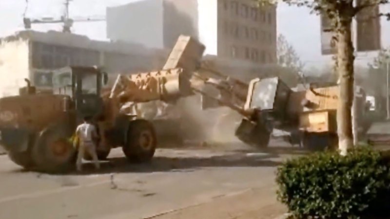 Chinese Heavy Equipment Gladiators Fight On The Street