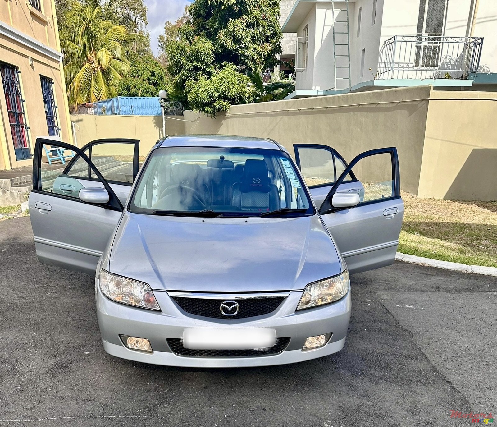 2004' Mazda 323F photo #1