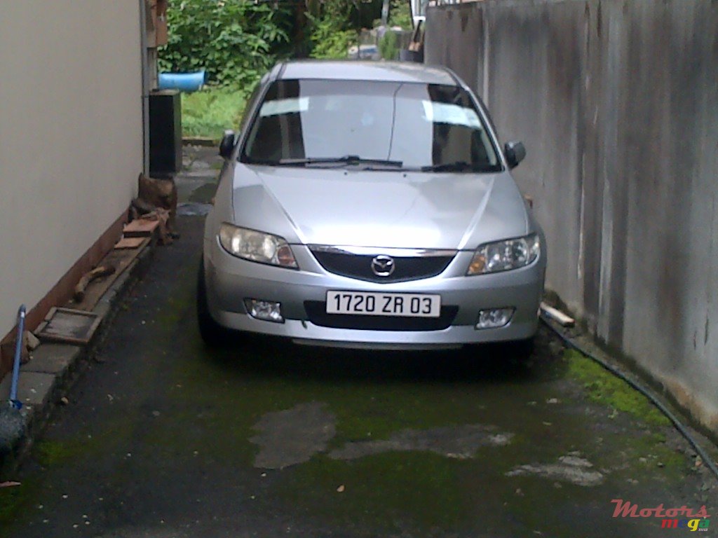 2003' Mazda 323 familia hatchback photo #1