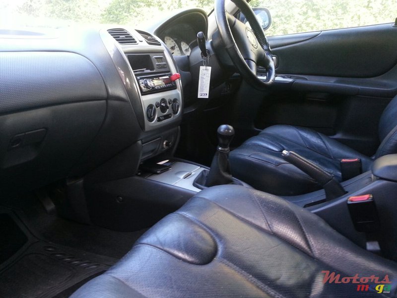 2003' Mazda 323 Body kit photo #3