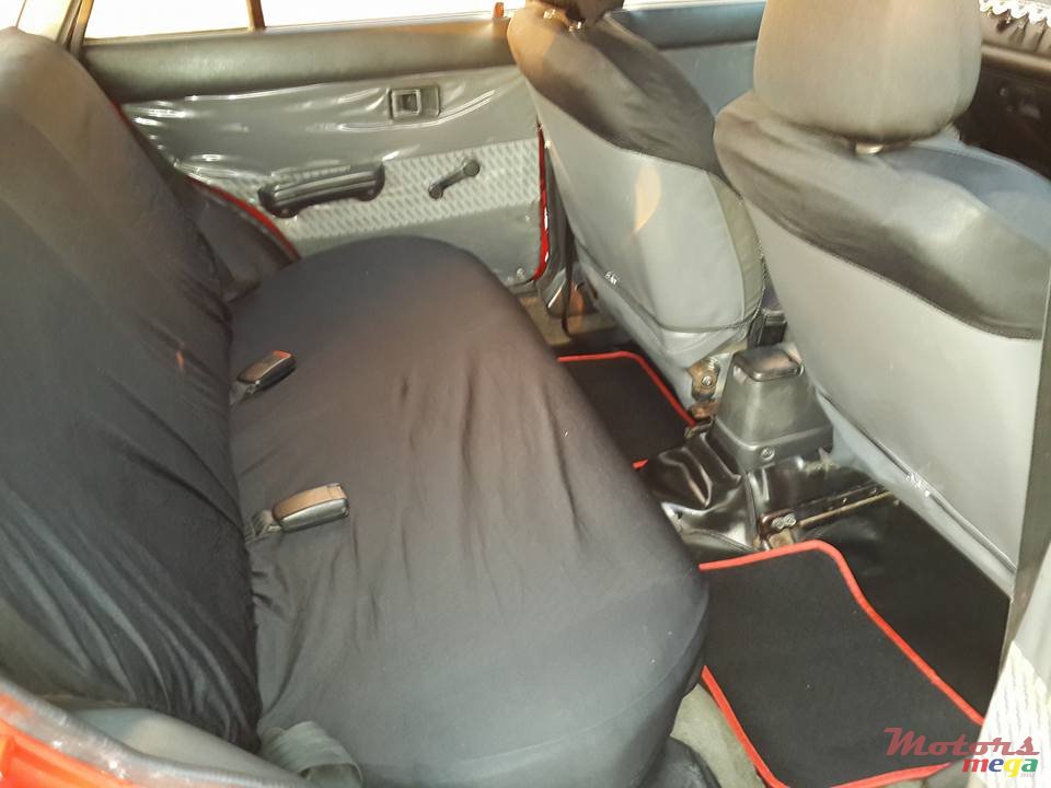 1993' Mazda 323 5d photo #5