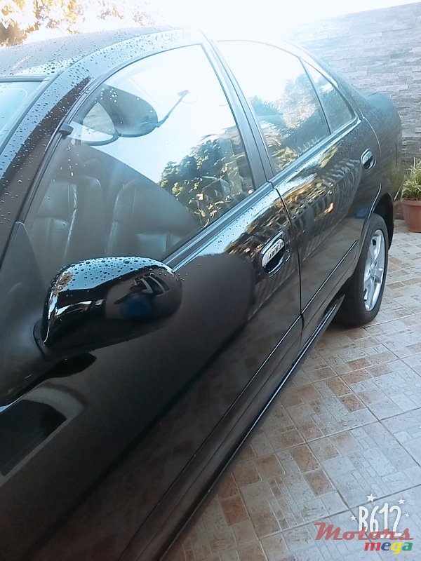 2004' Nissan Sunny photo #1