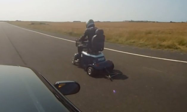 Watch this Mobility Scooter Drag Race a Nissan Skyline with Surprising Results