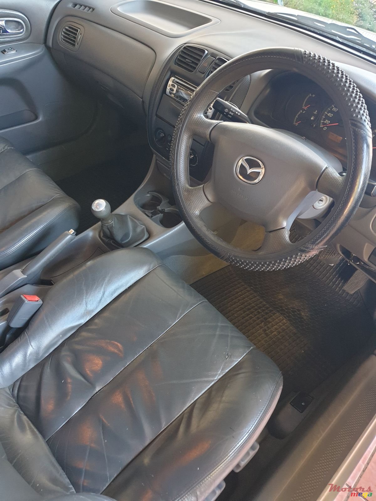 1999' Mazda 323 photo #4