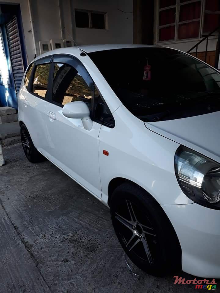 2004' Honda Fit Tinted windows, alloy tires photo #7