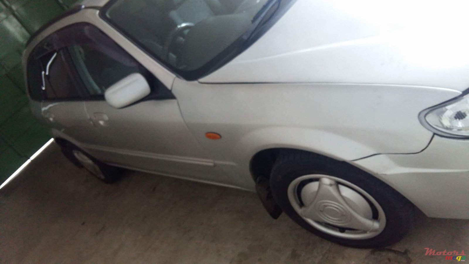 2001' Mazda 323 Hatch Back photo #1