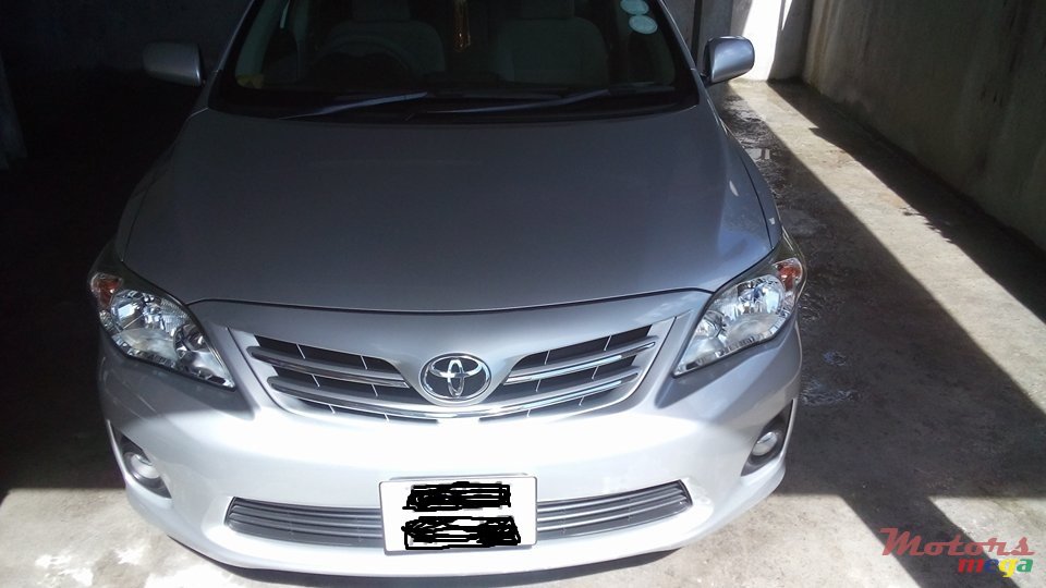 2012' Toyota Corolla G saloon photo #1