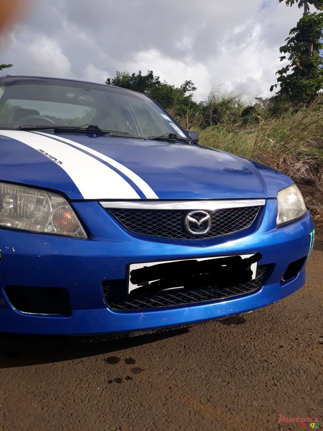 2003' Mazda 323 photo #1