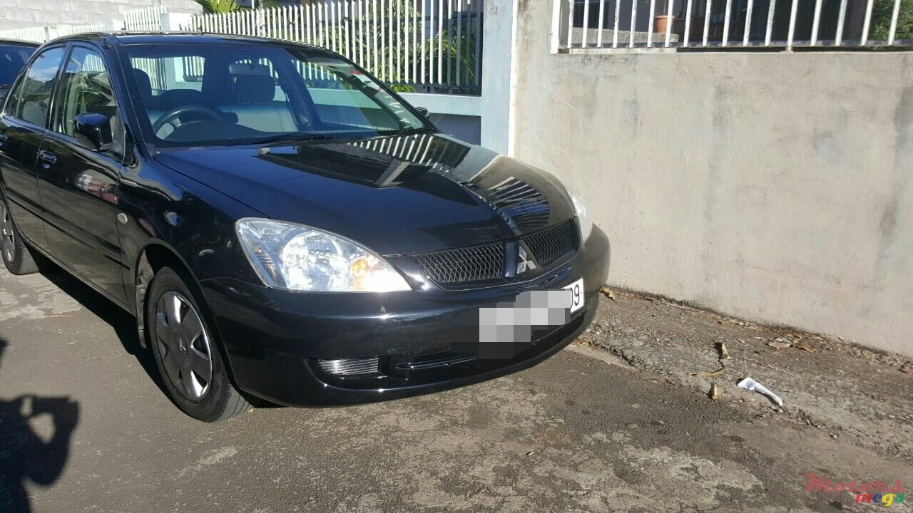 2009' Mitsubishi Lancer glx photo #1