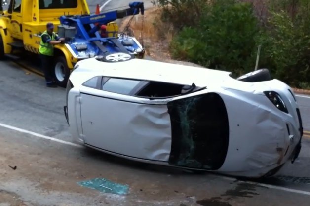 Tow Truck Driver Hilariously Bad at Righting a Flipped Mazda