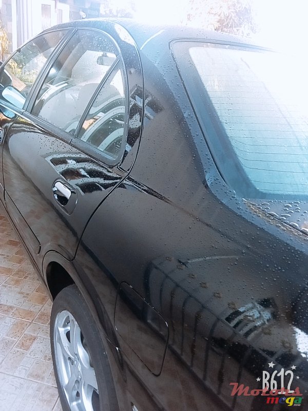 2004' Nissan Sunny photo #2