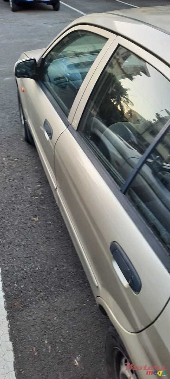 1999' Mazda 323 photo #7