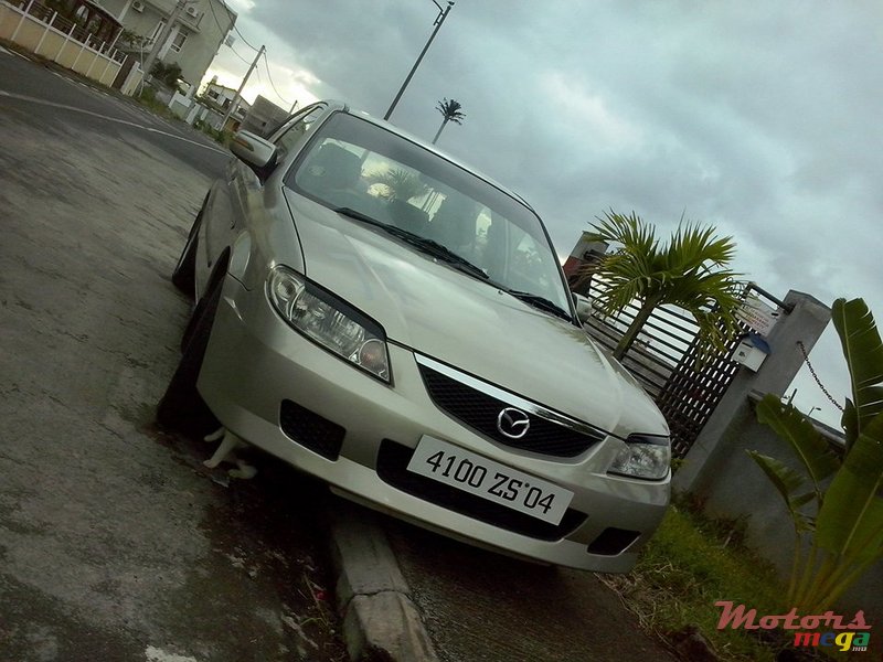 2004' Mazda Familia 323 photo #1