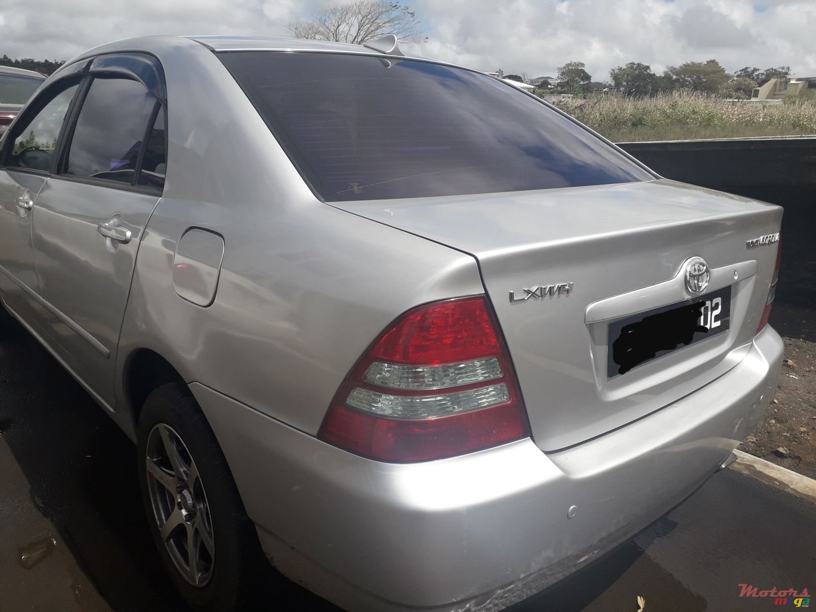 2002' Toyota Corolla NZE auto photo #1