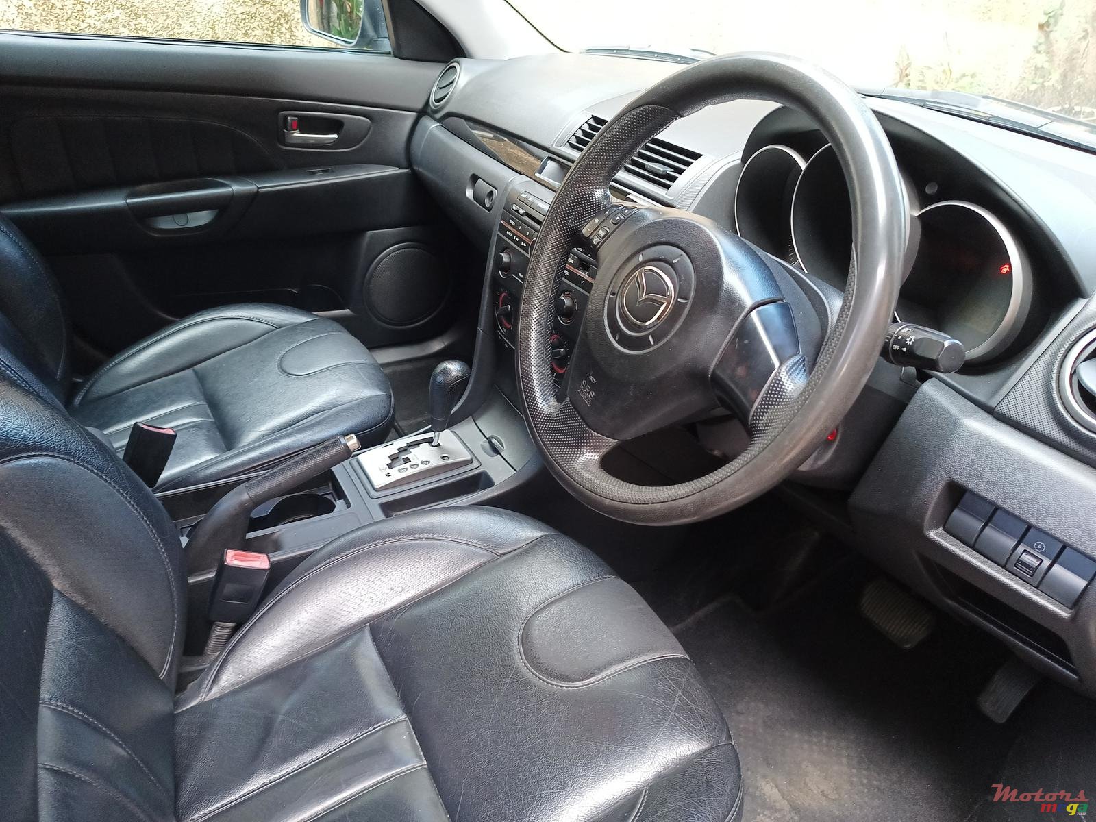 2004' Mazda 3 photo #1