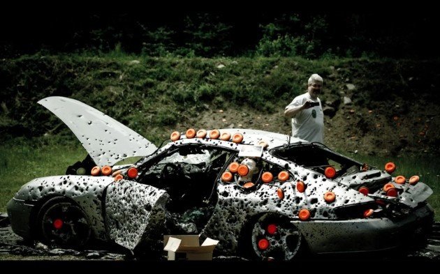 Hapless Porsche 911 gets lit up with 10,000 rounds of ammunition
