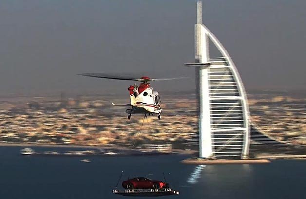 Watch Aston Martin Helicopter a Vanquish onto Dubai's Burj Al Arab Hotel