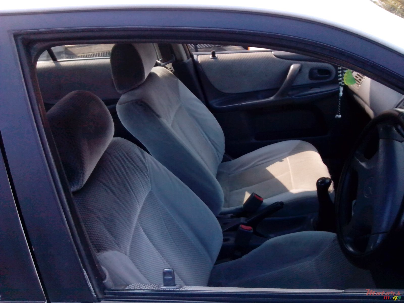 1999' Mazda 323 sedan photo #4